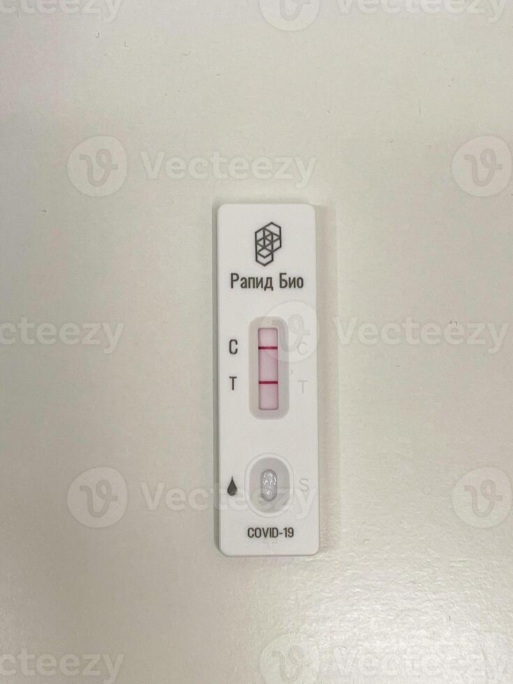 Test positive using a COVID-19 rapid testing device photo