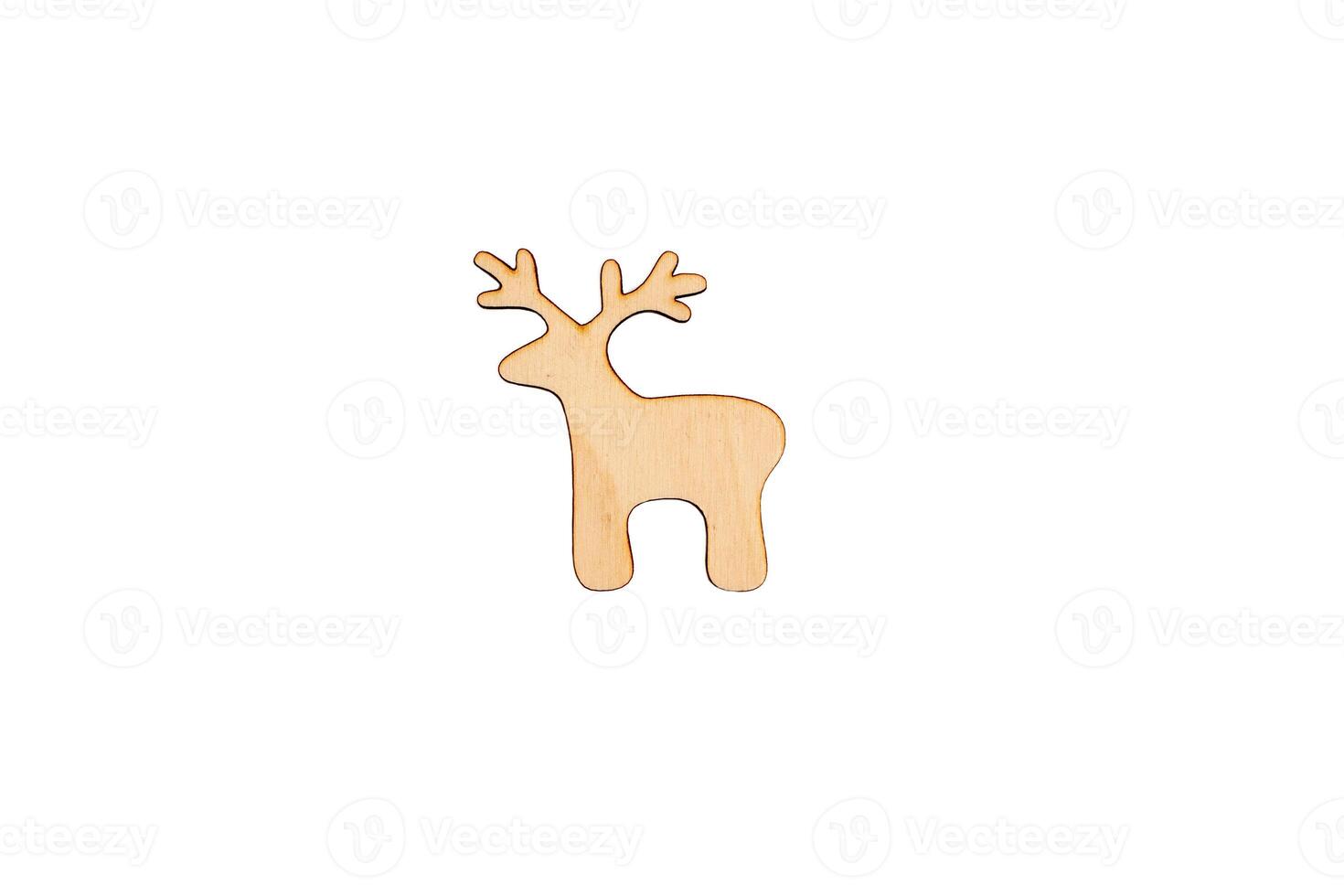 Wooden flat blank in the form of a deer figure on a white isolated background. photo