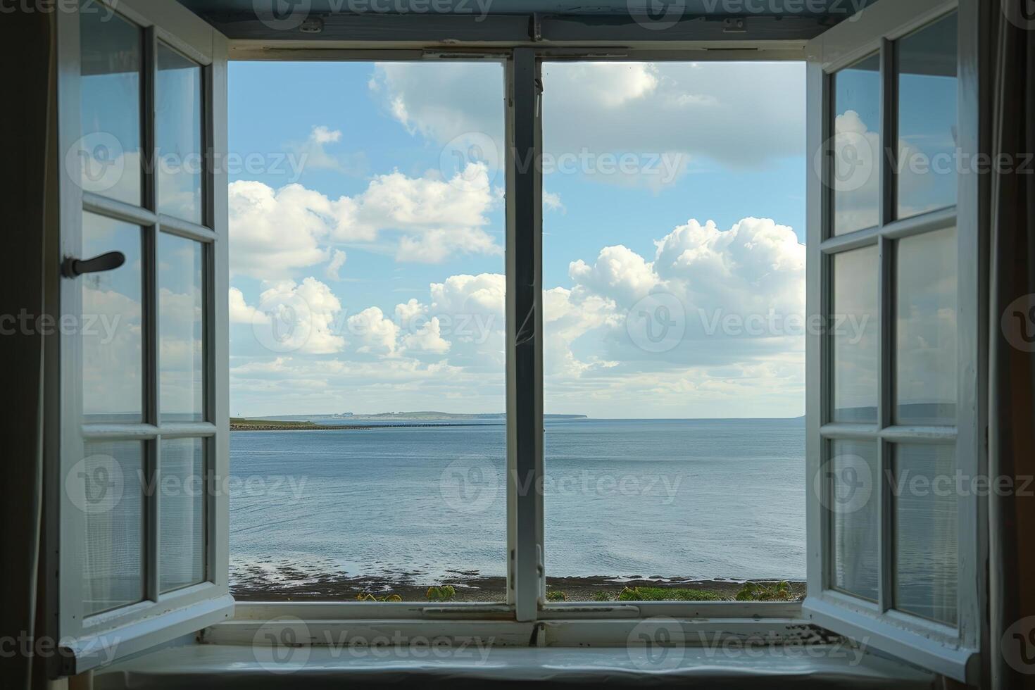 Serene ocean view from open window overlooking cloudy sky and tranquil beach photo