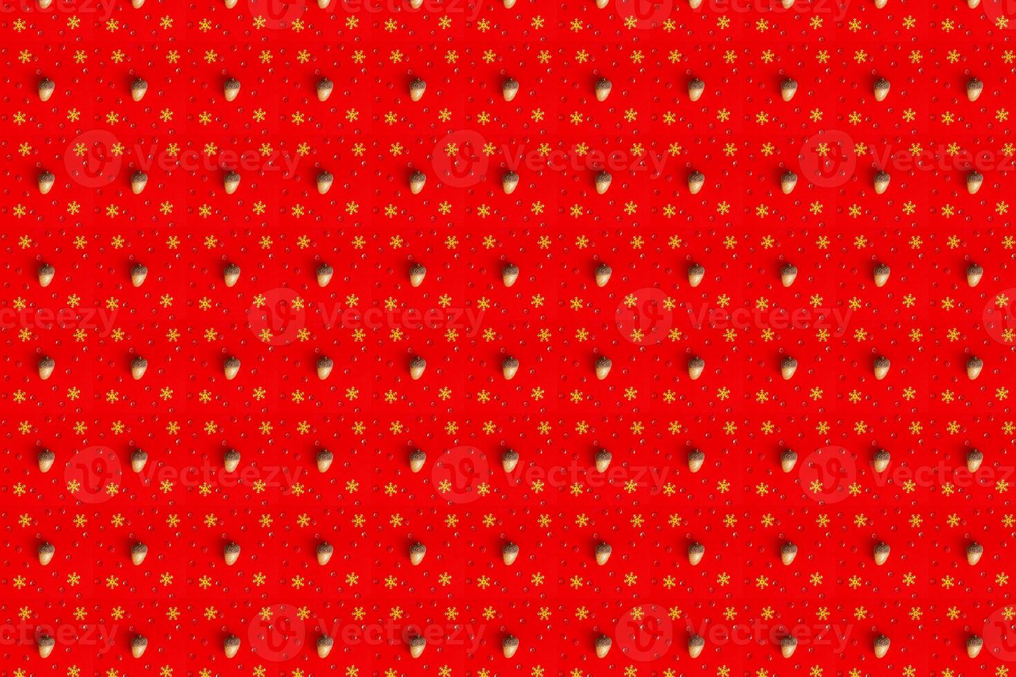 Pattern made of red Christmas balls on red background. Flat lay photo