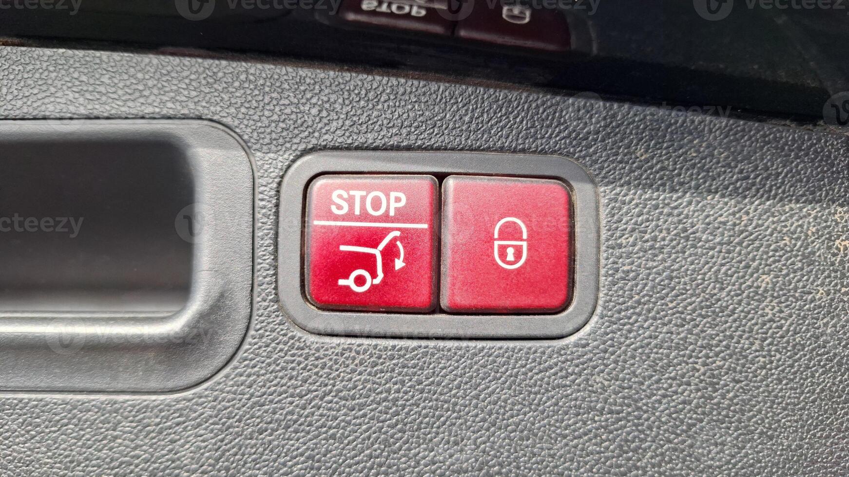 Car interior buttons for trunk operation and locking system photo