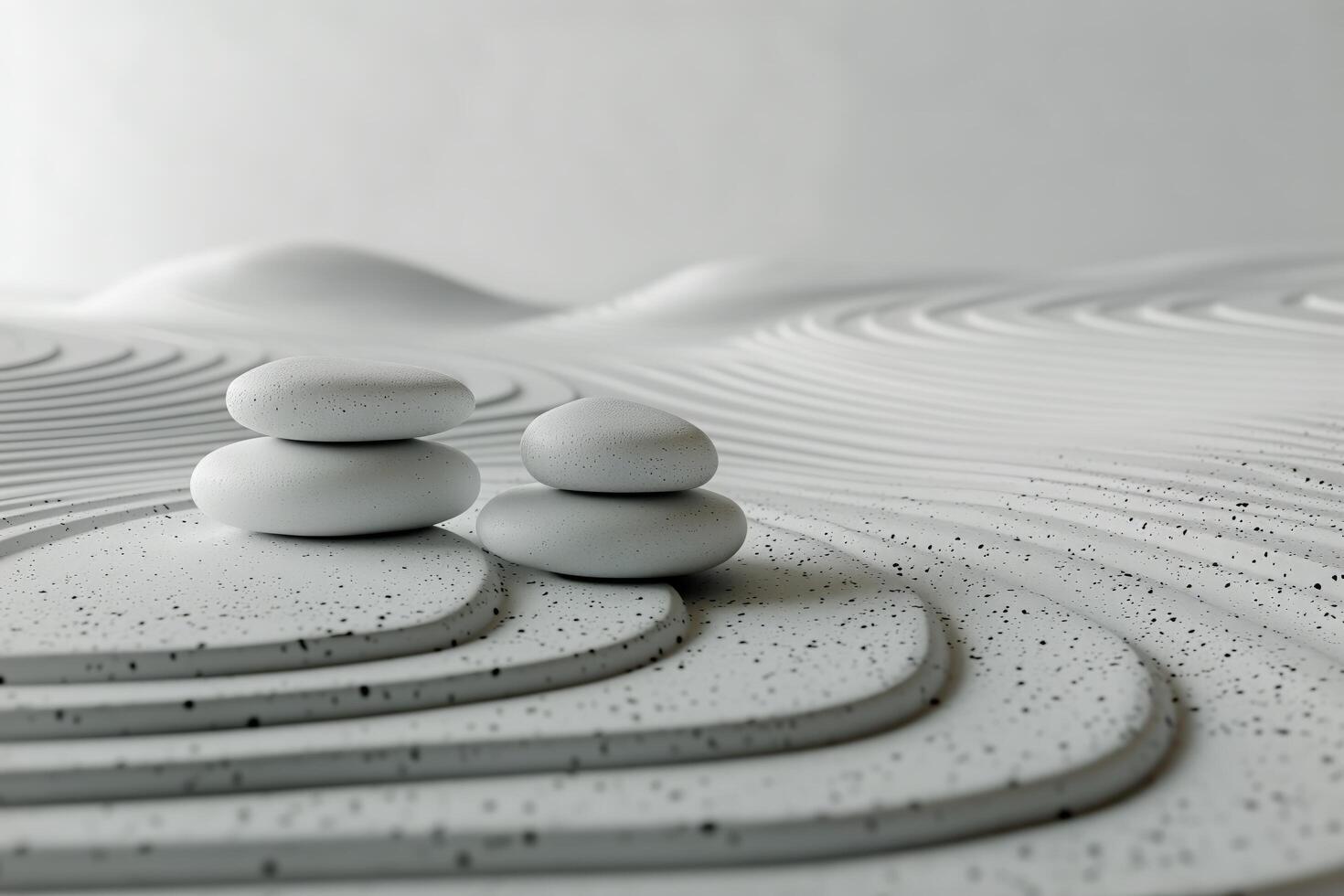 Two white stones sitting on top of a white sand photo