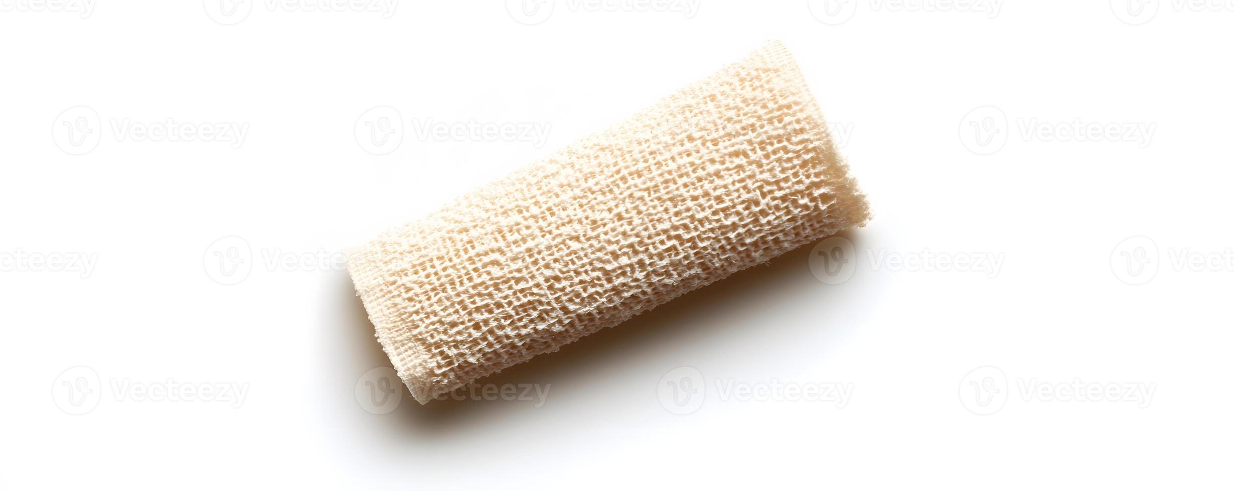 A Rolled Natural Loofah Sponge on White Background photo