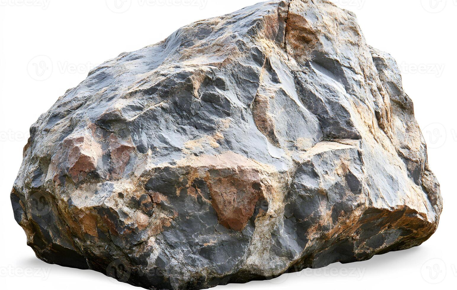 A large grey rock with brown and tan markings photo