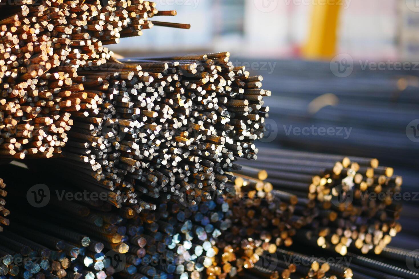 Steel rods stacked in a construction yard during daytime photo