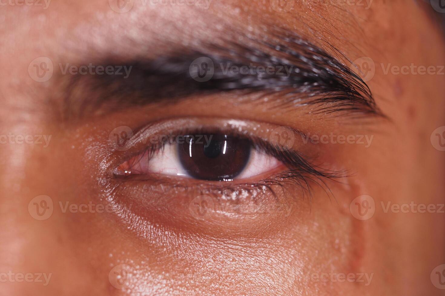 Close-up of a human eye showing intricate details and emotions photo