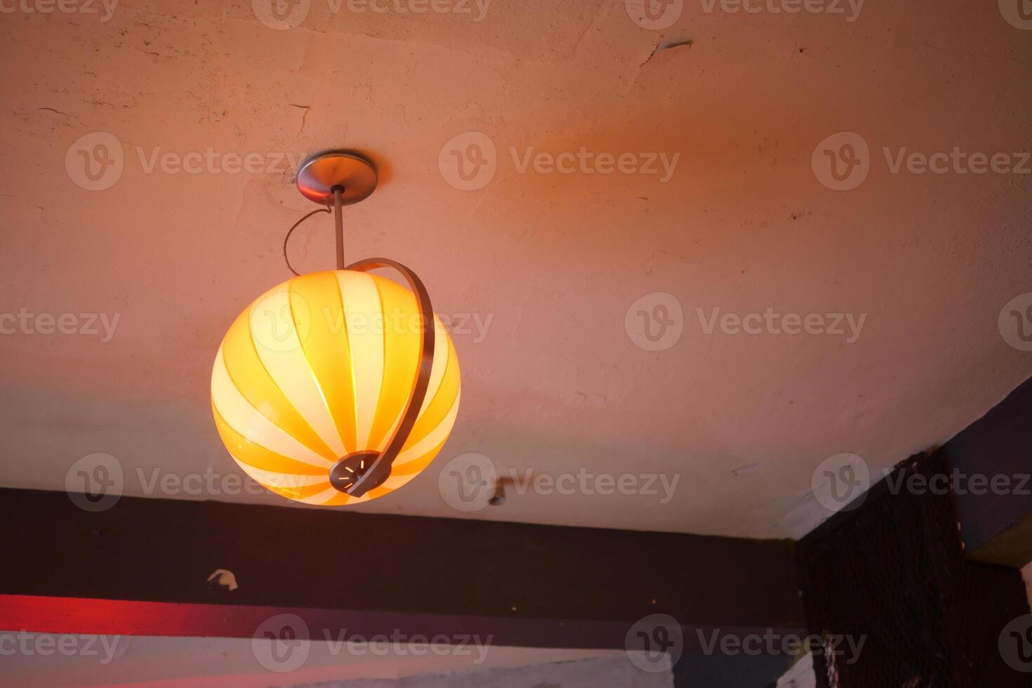 Unique hanging lamp in a cozy indoor setting photo