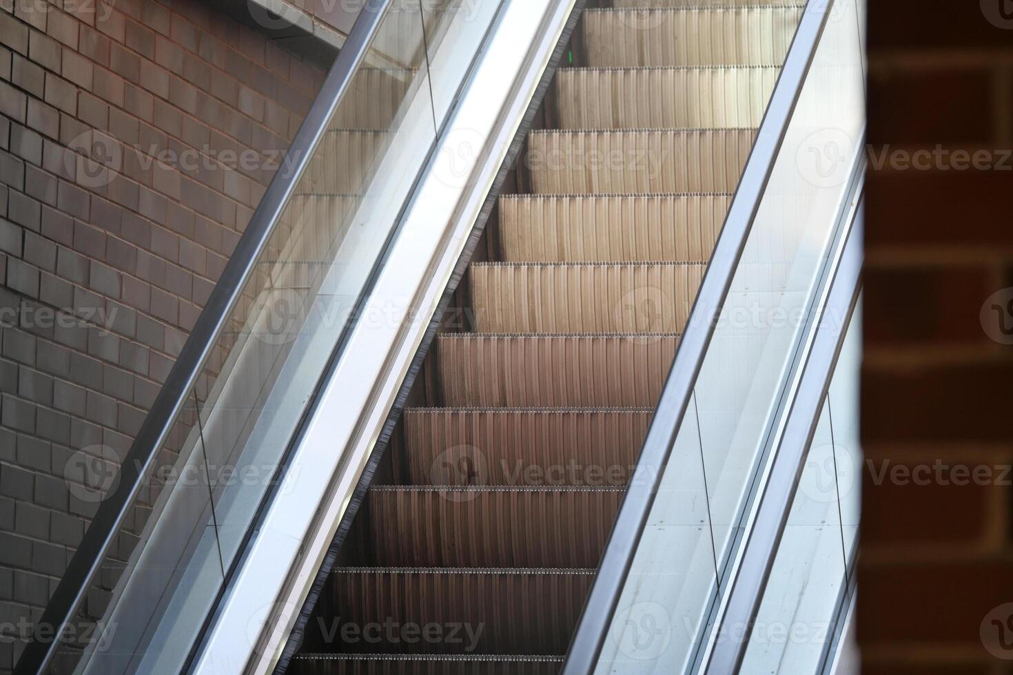 Moving walkway in a modern building during daylight hours photo