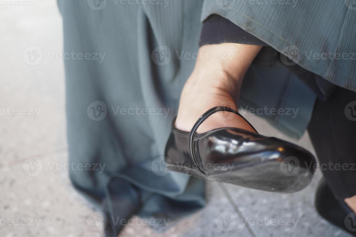 Woman wearing black ballet shoes at an indoor event photo