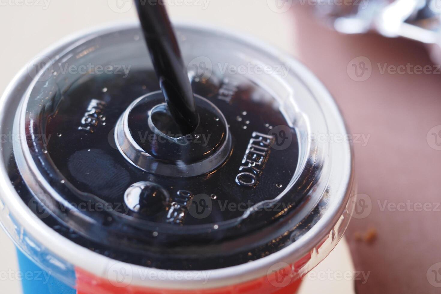 Refreshing drink in vibrant cup during a sunny afternoon photo