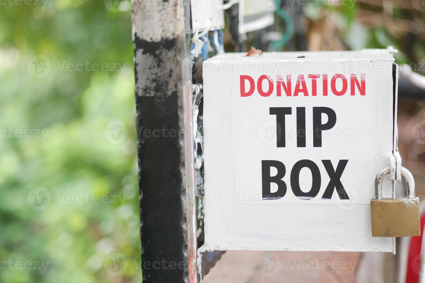 Community donation tip box inviting support for local initiatives photo