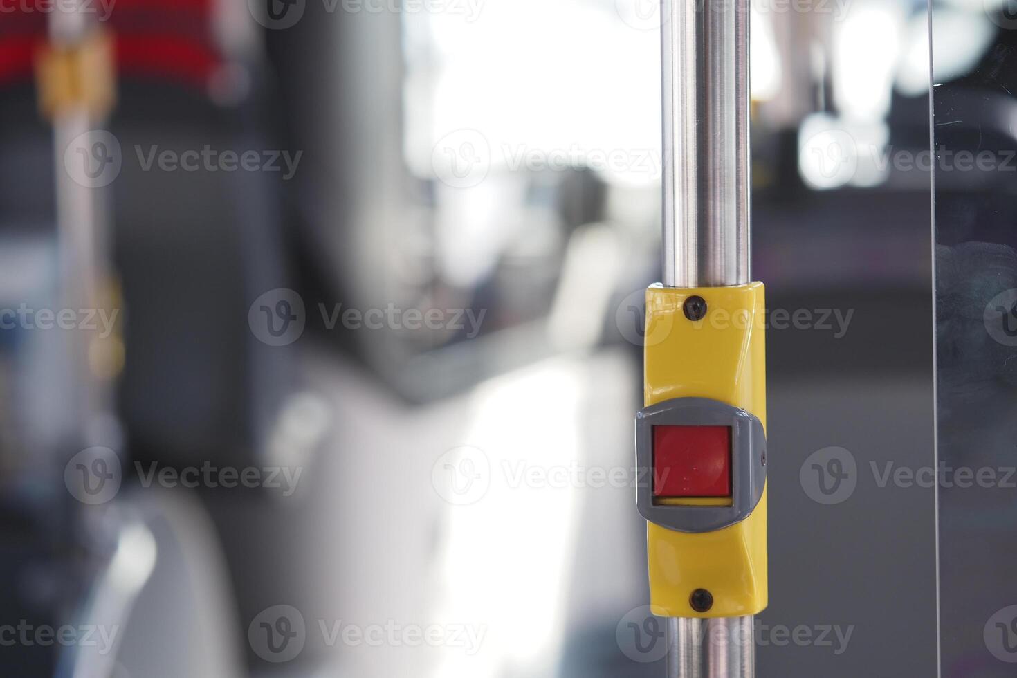 Public transportation stop request button on bus interior photo