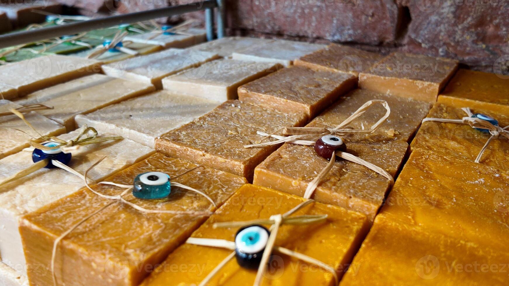 Handcrafted soap bars displayed in a local market setting photo