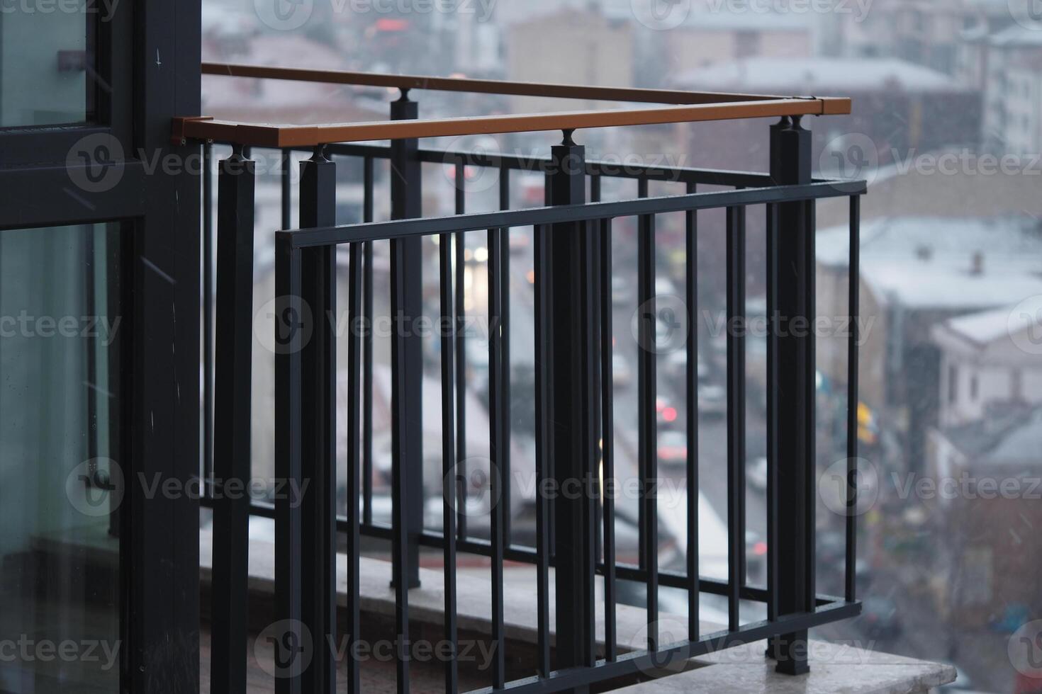 Balcony with city view on a rainy day in urban setting photo