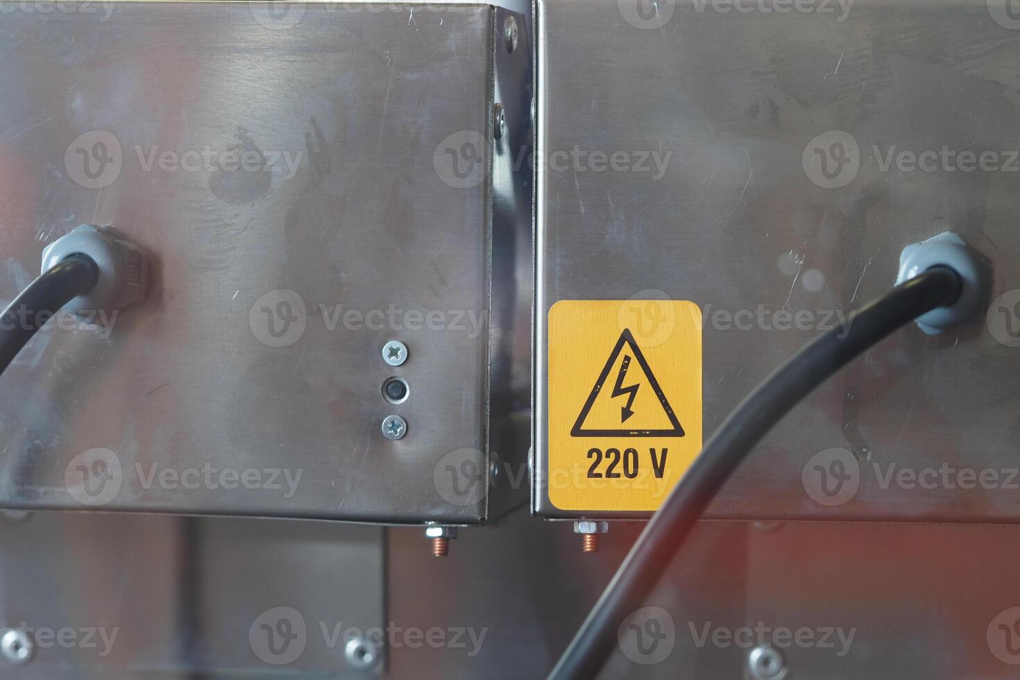 Electrical equipment displaying safety warnings at a workshop photo