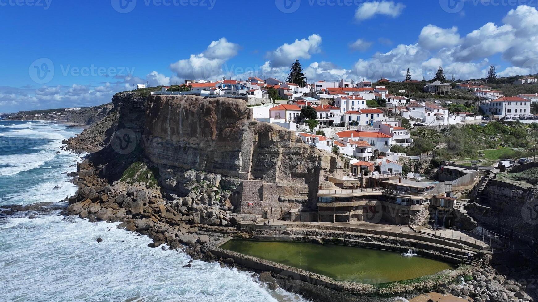 High Angle of azenhas do mar beach in Sintra District of Lisbon in Portugal.. Vacation Boat. photo