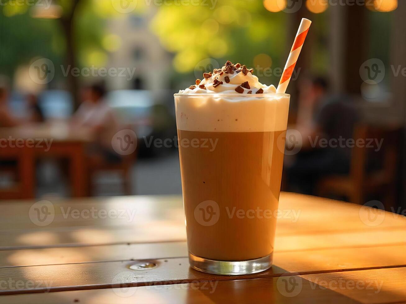 A refreshing ice mocha with whipped cream and chocolate shavings on a sunny cafe table photo