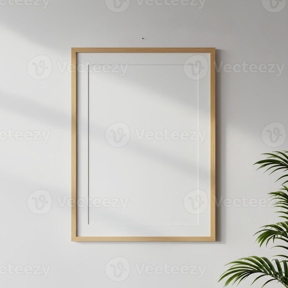 mock up of plain white frame hanging on a white wall photo