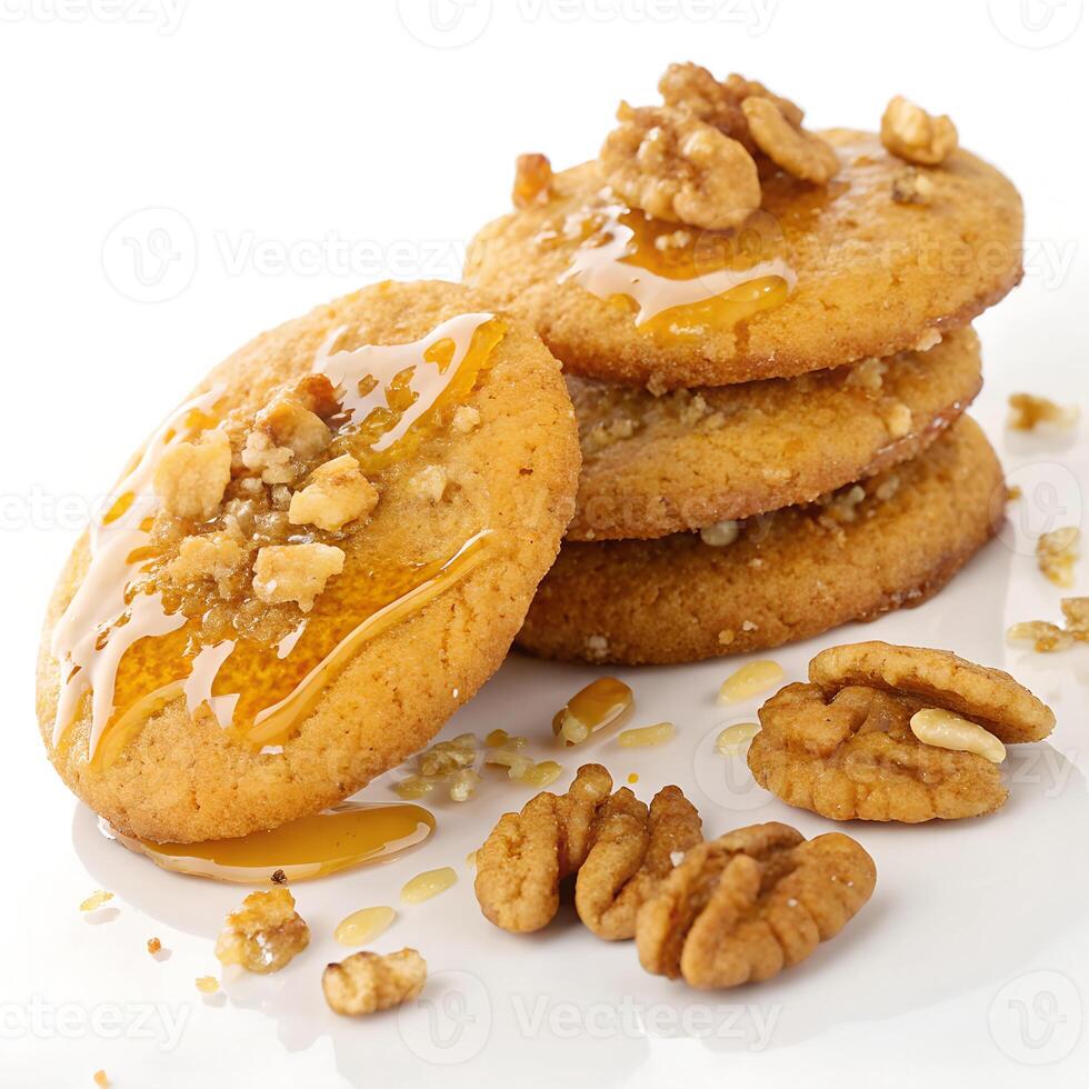 Stack of four honey cookies with walnuts on a white background photo