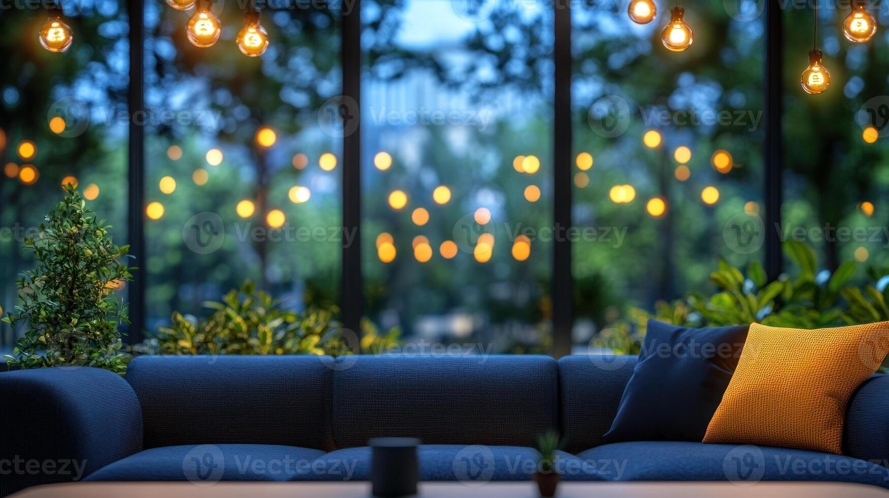 Comfortable couch in a serene space, illuminated by warm lights, offering a view of lush greenery outside photo