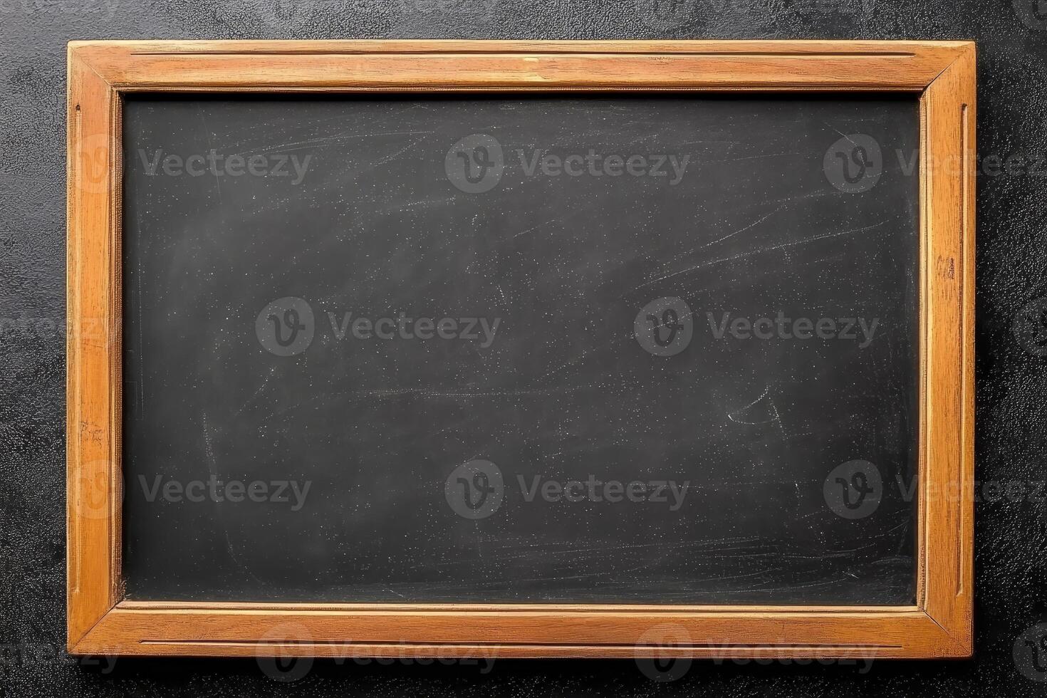 Chalkboard, wooden frame isolated on dark grey background. photo