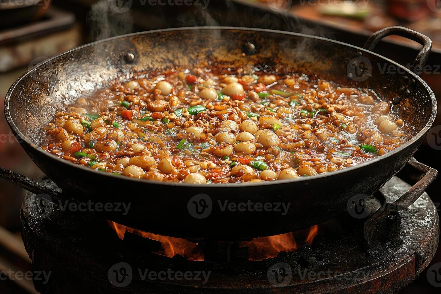 Steaming Wok of Chinese Stir-Fry on a Charcoal Stove photo