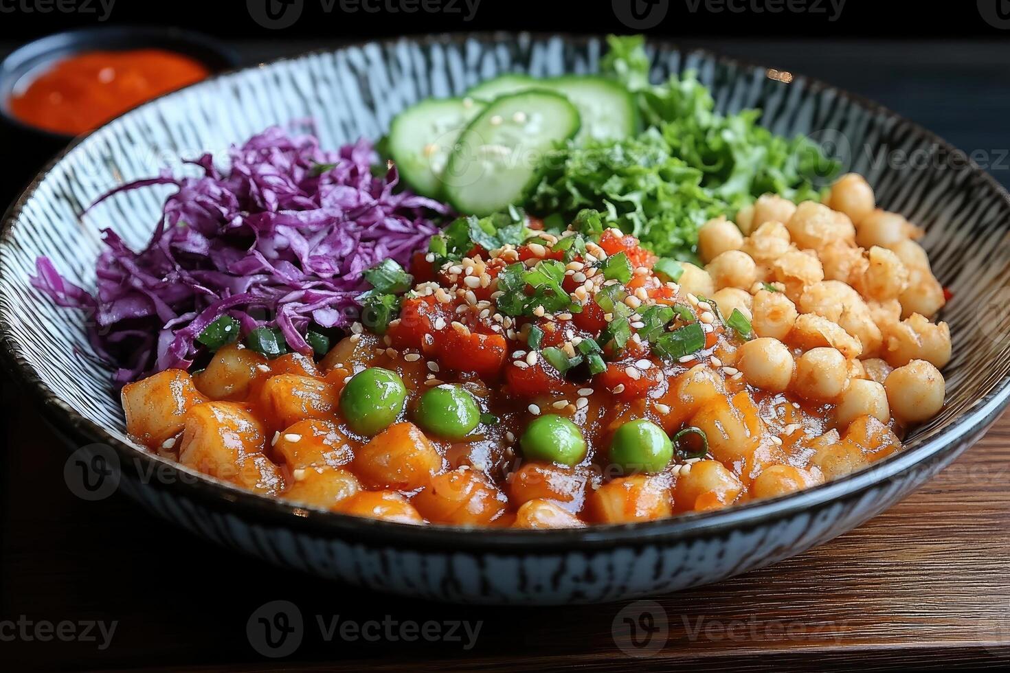 Bowl of Savory Dumplings with Vegetables and Sauce photo
