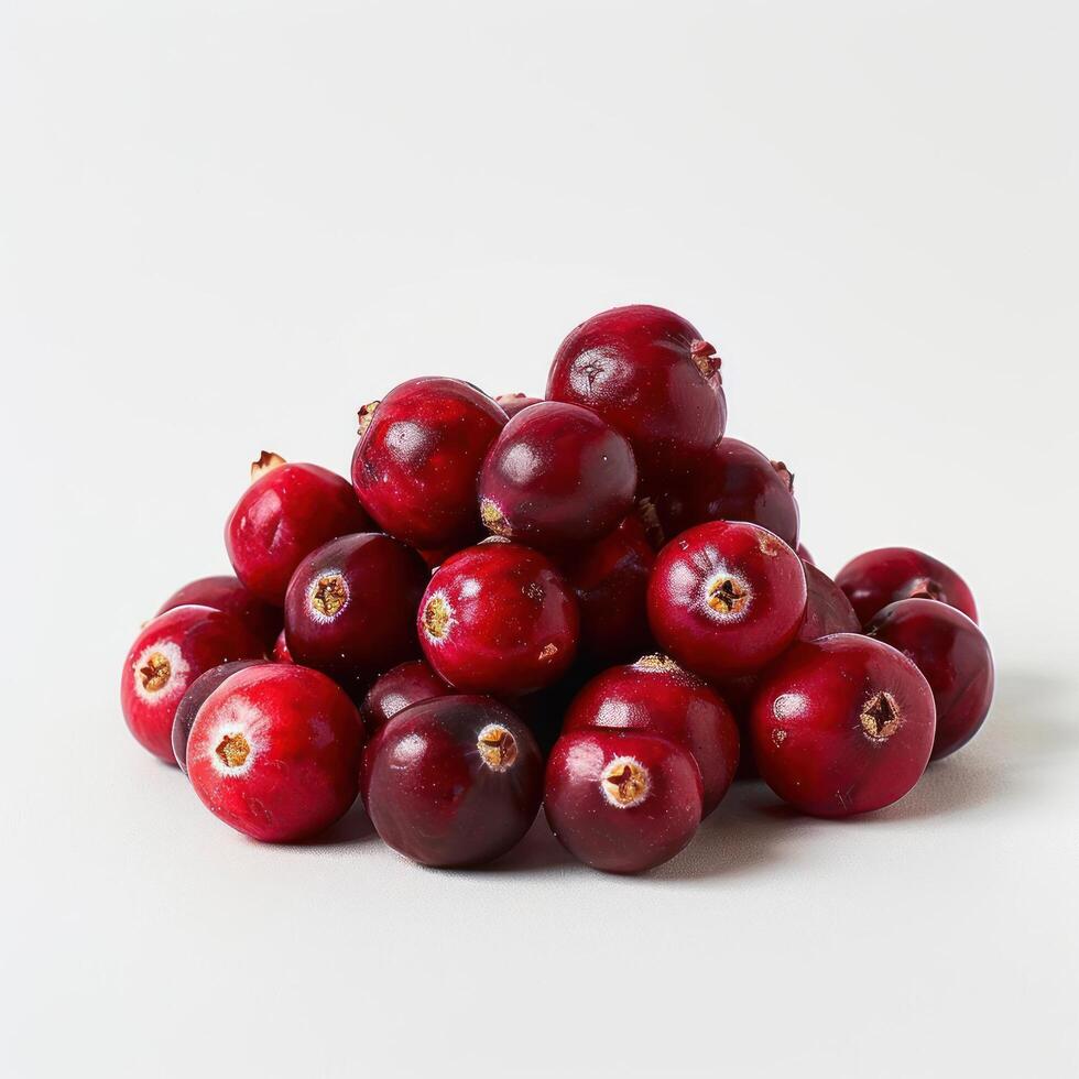 A collection of cranberries neatly organized in a pyramid shape, displayed on a white background. photo