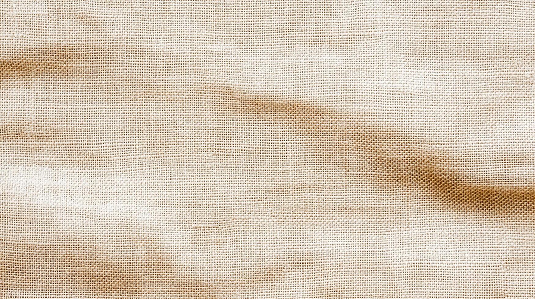 Rustic Beige Burlap Fabric with Natural Wrinkles and Texture photo