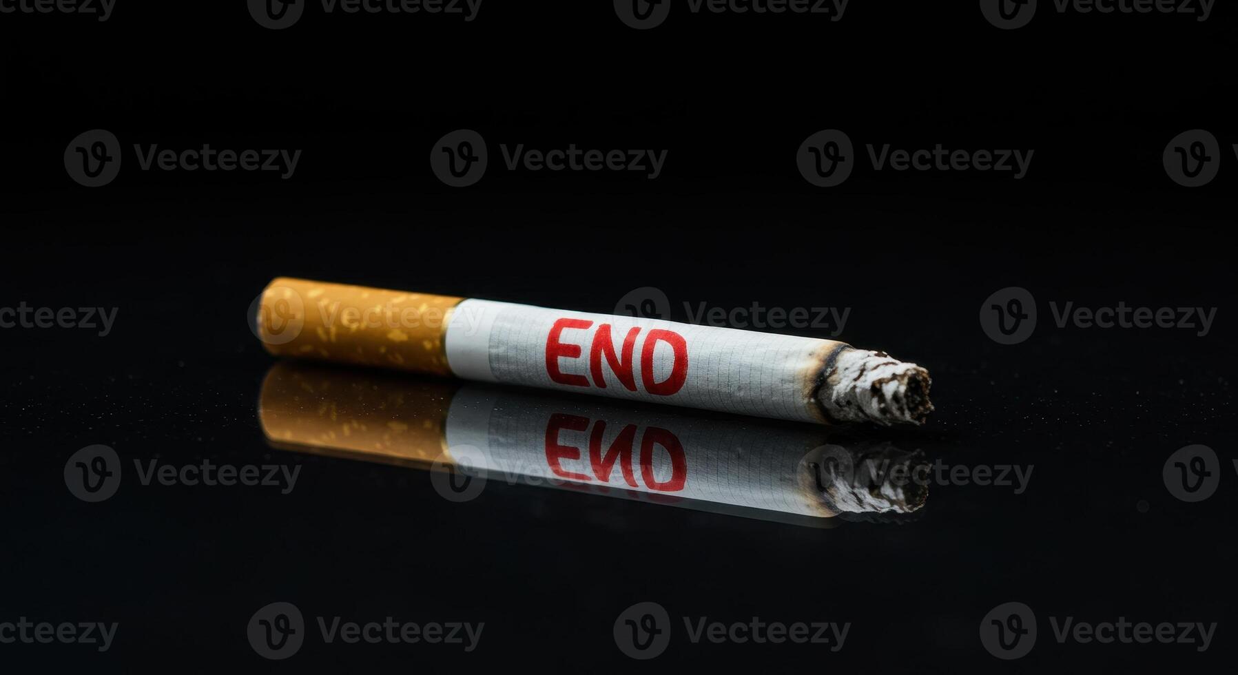 Close up of a lit cigarette with the word END in red on its side, symbolizing quitting smoking and the health risks associated with tobacco use on a reflective surface. photo