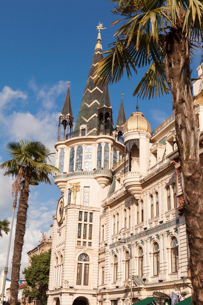 Batumi, Adjara, Georgia, 2018 - Perspective view on the main tower of the Astronomical Clock Building at Europe Square. It has beautiful front and stained-glass window. photo