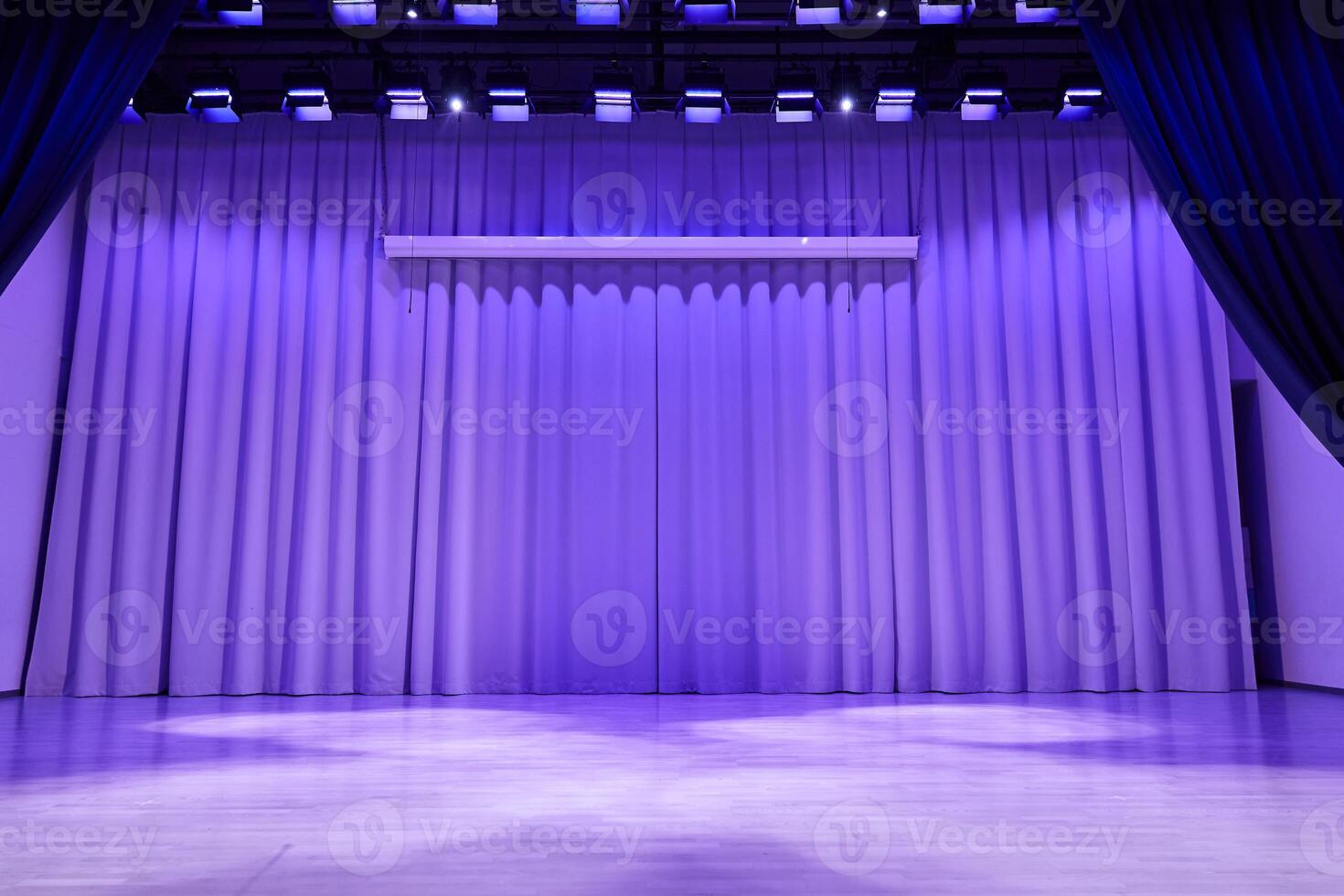 Fabric wavy background with space for copying. An element for your design. A podium stage with trendy purple lighting. photo