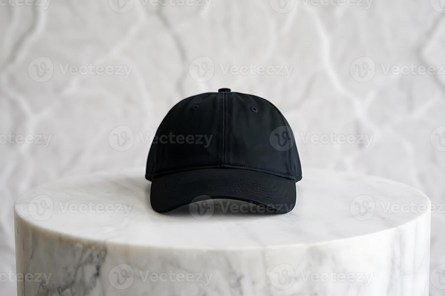A minimalist studio shot of a black baseball cap on a marble pedestal display photo