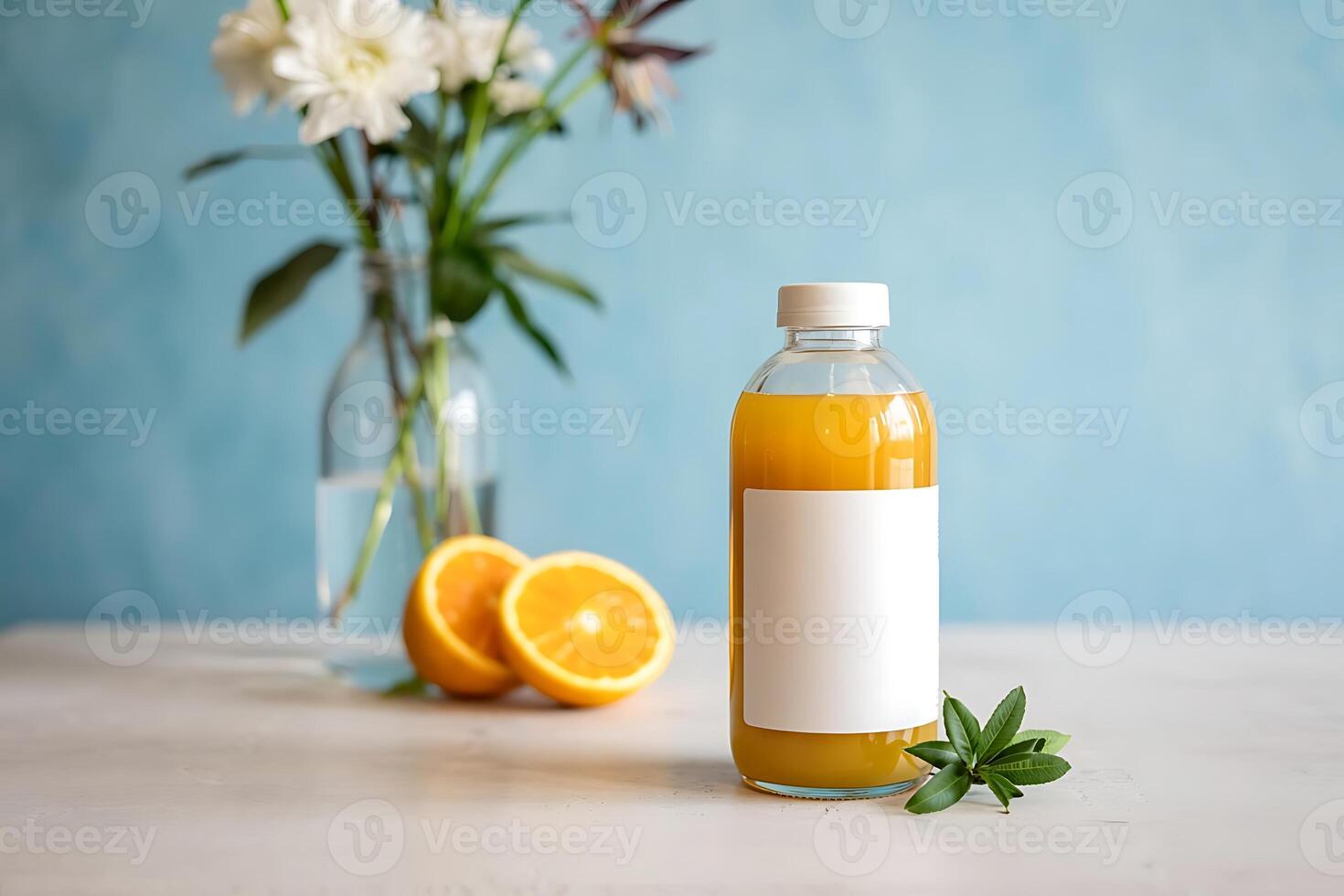 Refreshing orange juice bottle with blank label and halved oranges on table photo