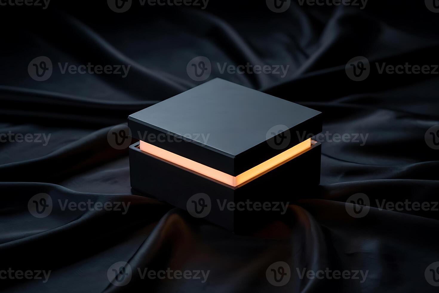 Minimalist box with illuminated glow, resting on luxurious dark silk fabric photo