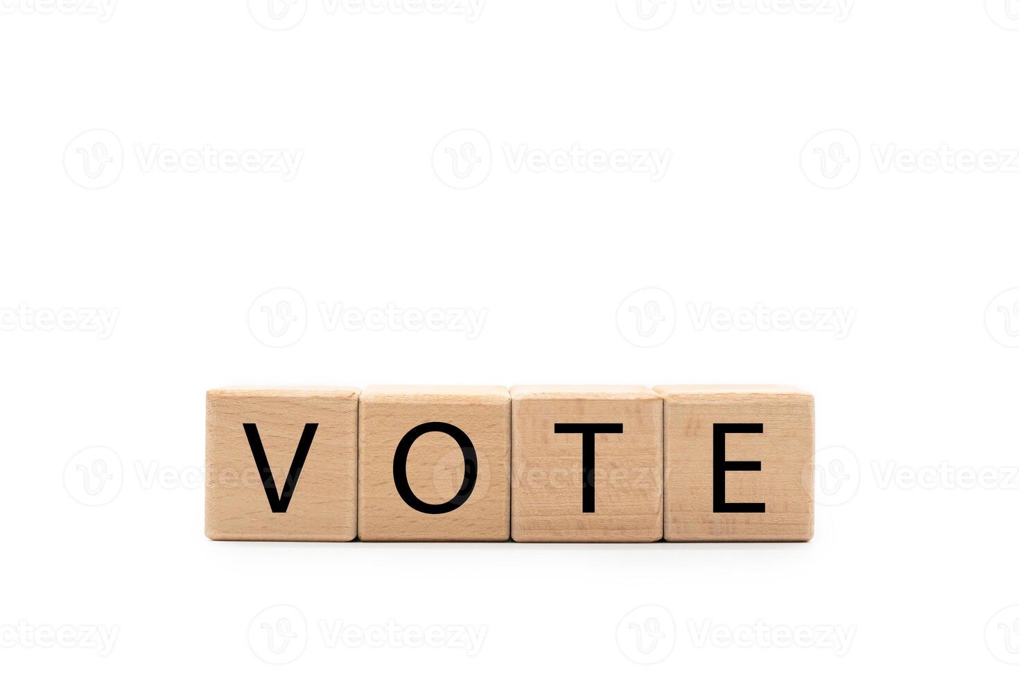 VOTE wooden blocks isolated on white background. copy space and clipping path. Voting in democratic elections. Wooden cubes. photo