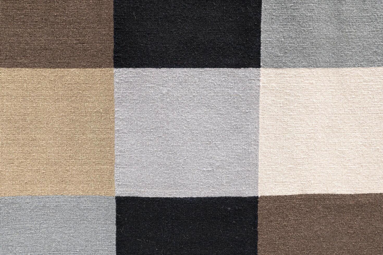 Neutral Toned Woven Fabric Checkerboard Pattern. textured woven fabric featuring a checkerboard pattern in neutral tones. photo