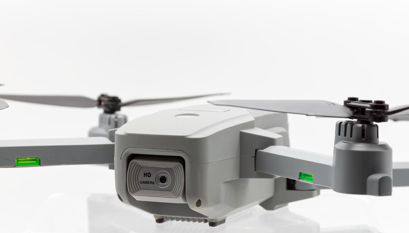 Drone with black propellers ready for flight isolated on white background. Close-up. photo