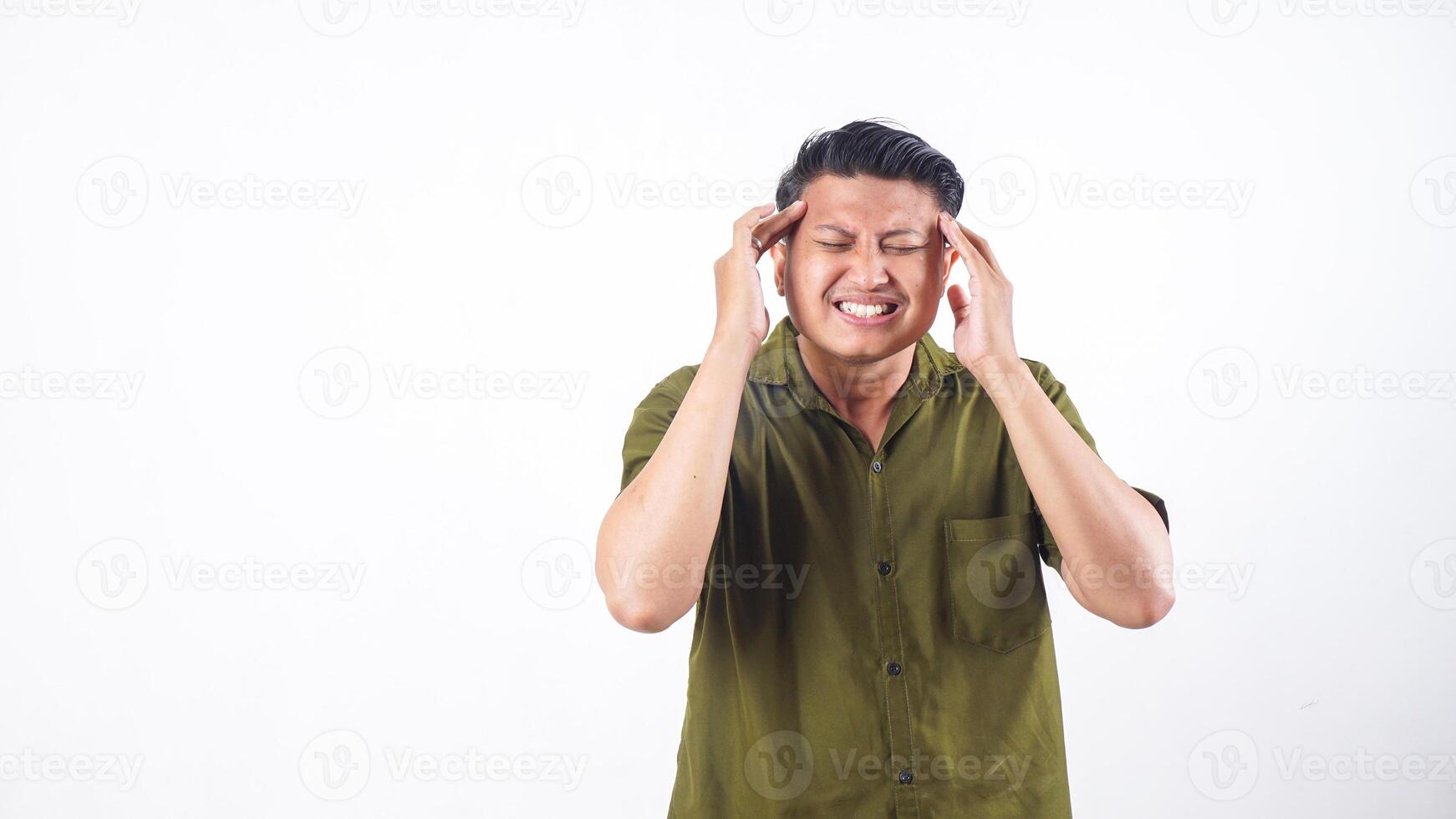 Asian man holding his head from severe headache isolated on white background photo