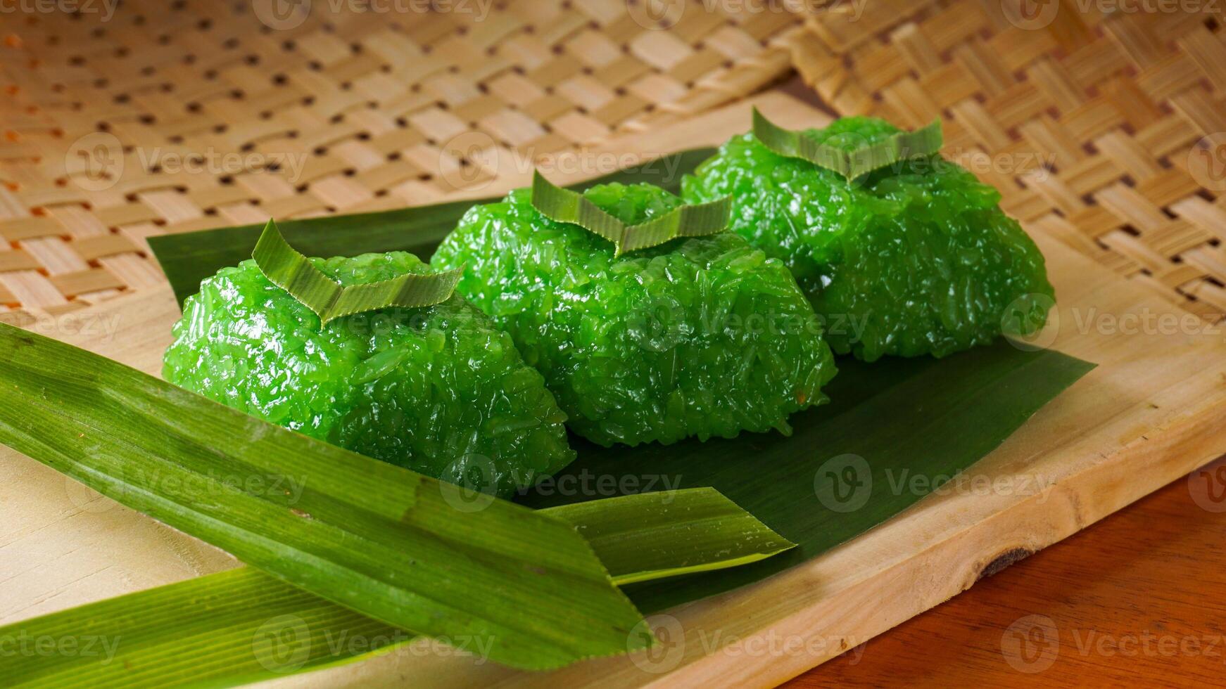 Tasty traditional Indonesian snack made from glutinous rice called wajik on banana leaves isolated on white background studio photo