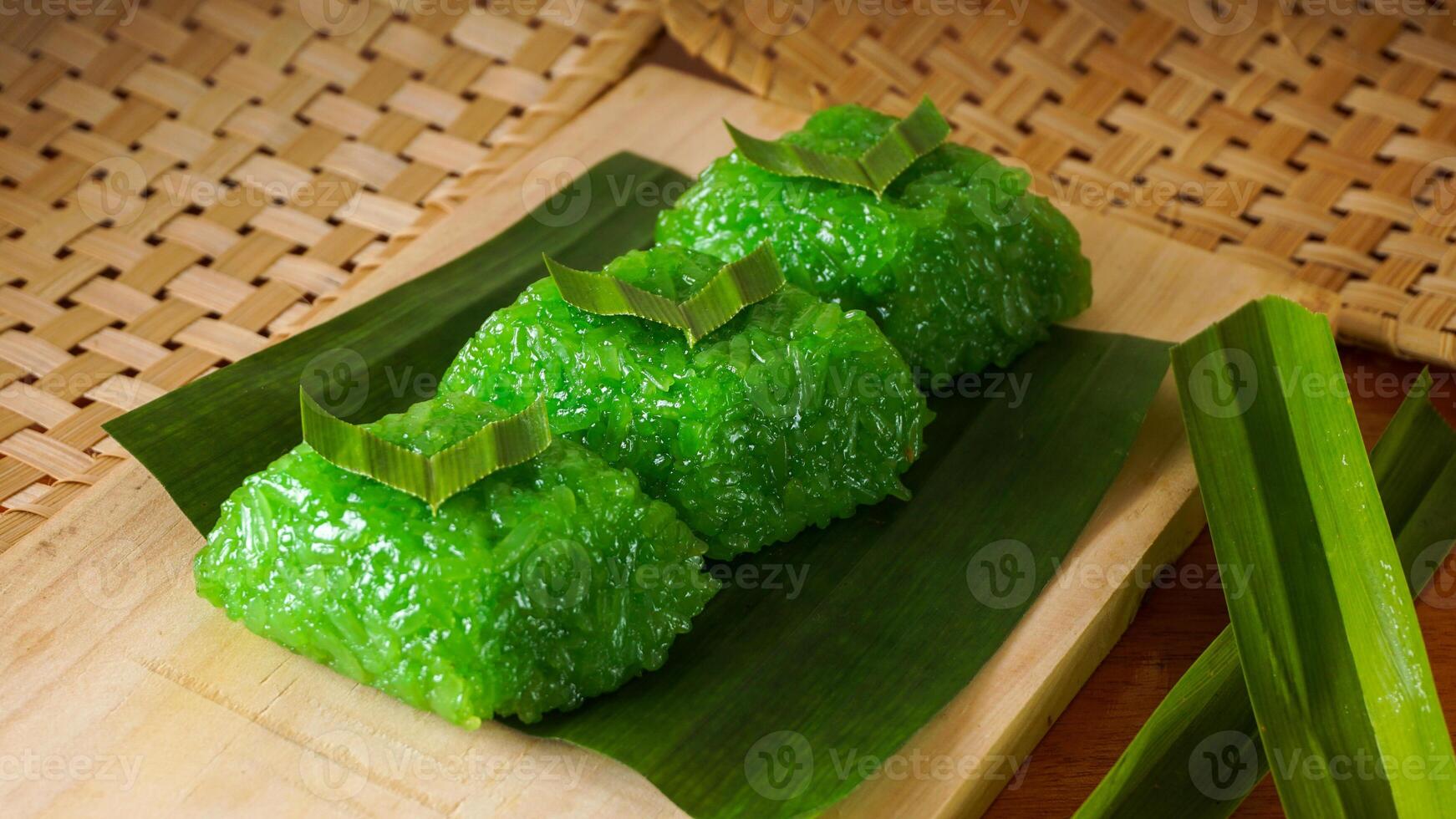 Sweet wajik, traditional Indonesian snack made from glutinous rice on banana leaves isolated on white background studio photo