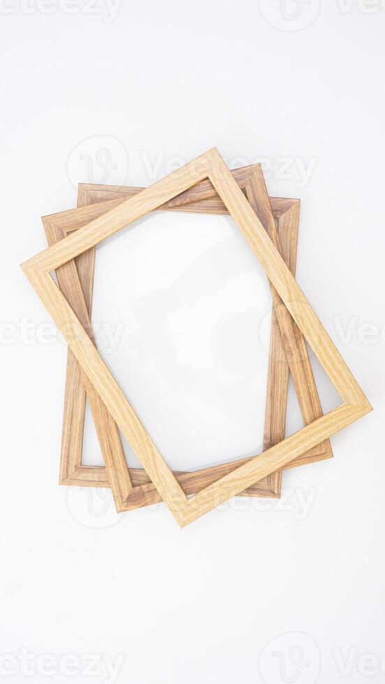 Simple wood picture frame isolated on white background photo