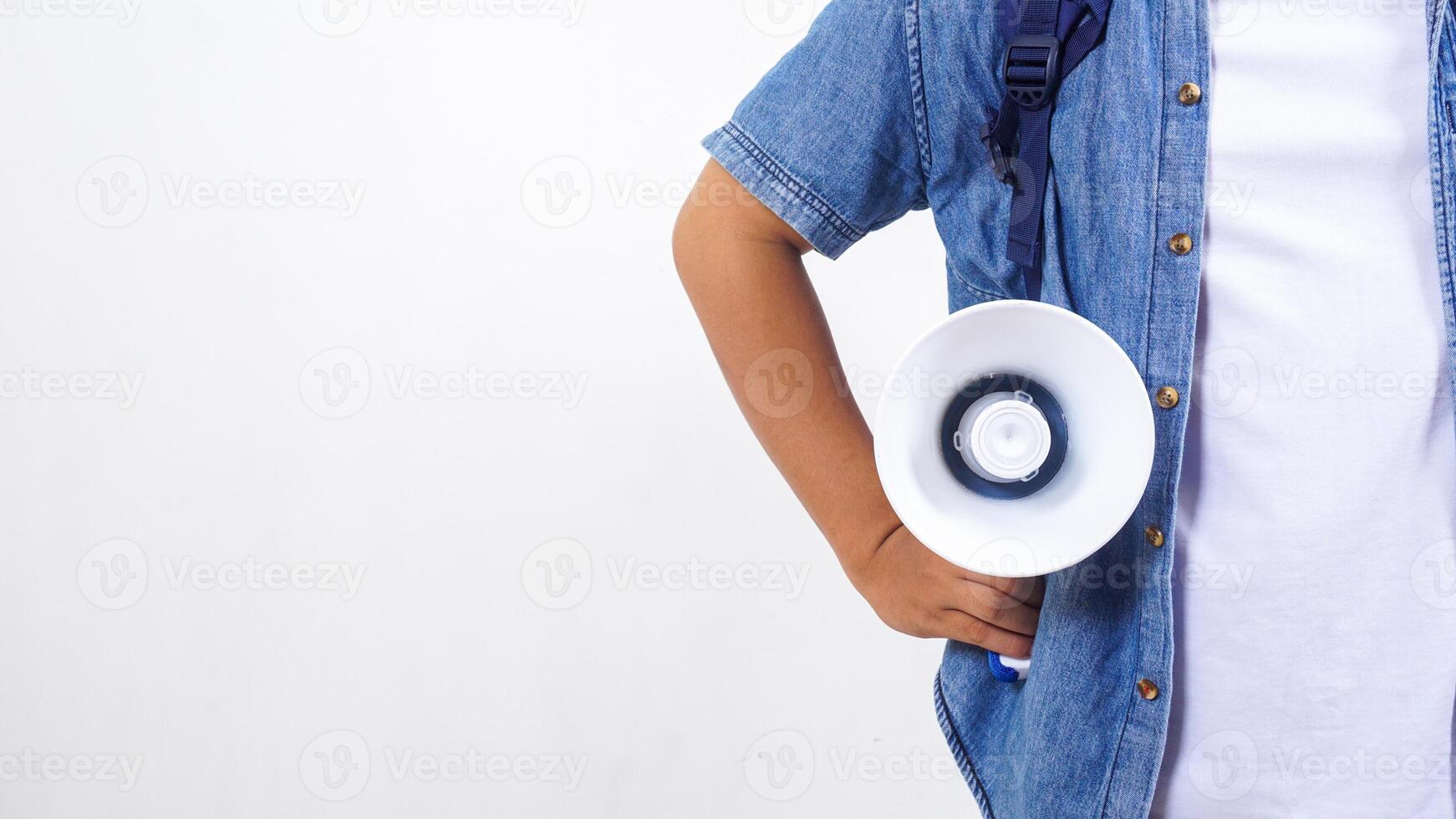 Close up of a young male university student in casual outfit with backpack and megaphone isolated on white background photo