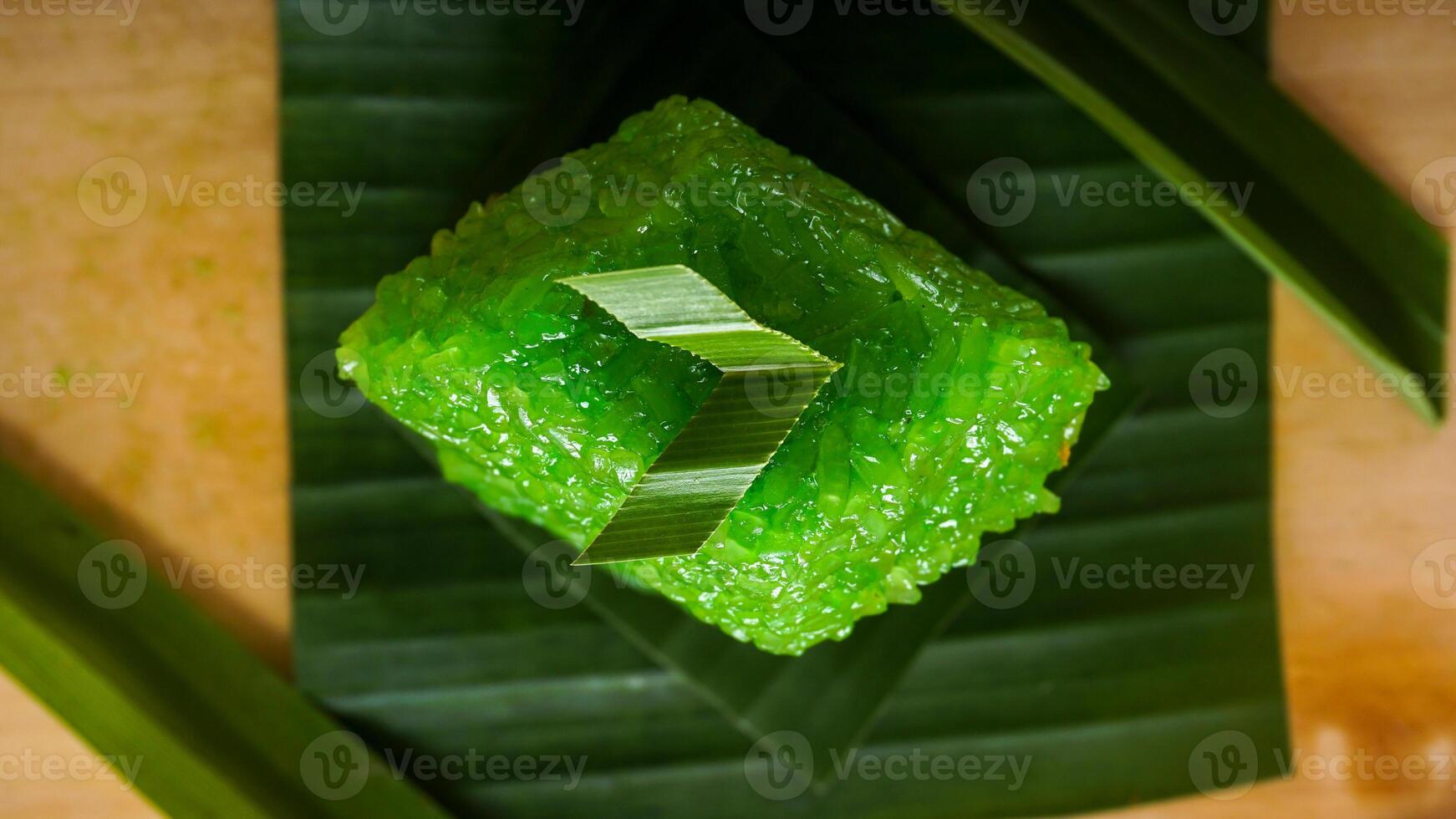Wajik, sweet traditional Indonesian snack made from glutinous rice on banana leaves isolated on white background studio photo