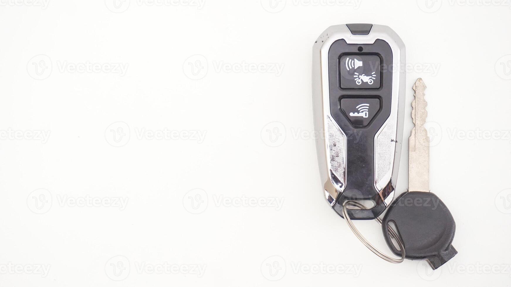 Black motorbike or motorcycle key and smart key isolated on white background photo