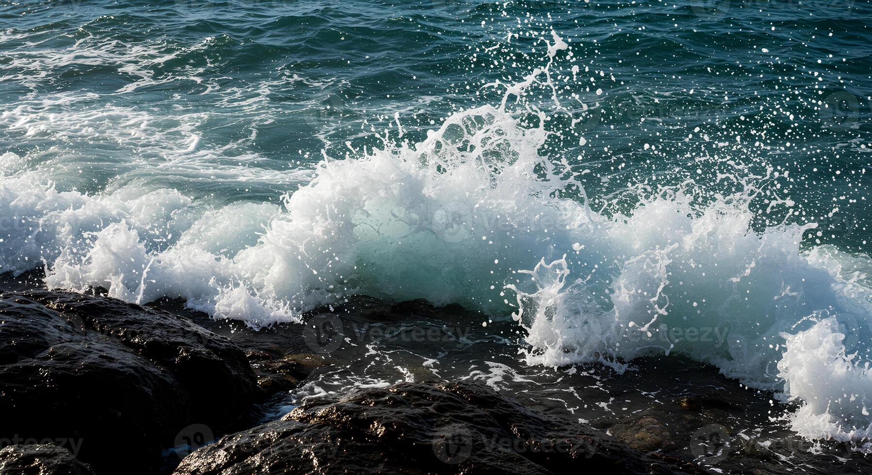 Ocean surf hitting rugged rocks closeup for beach, nature and summertime adventure concepts photo