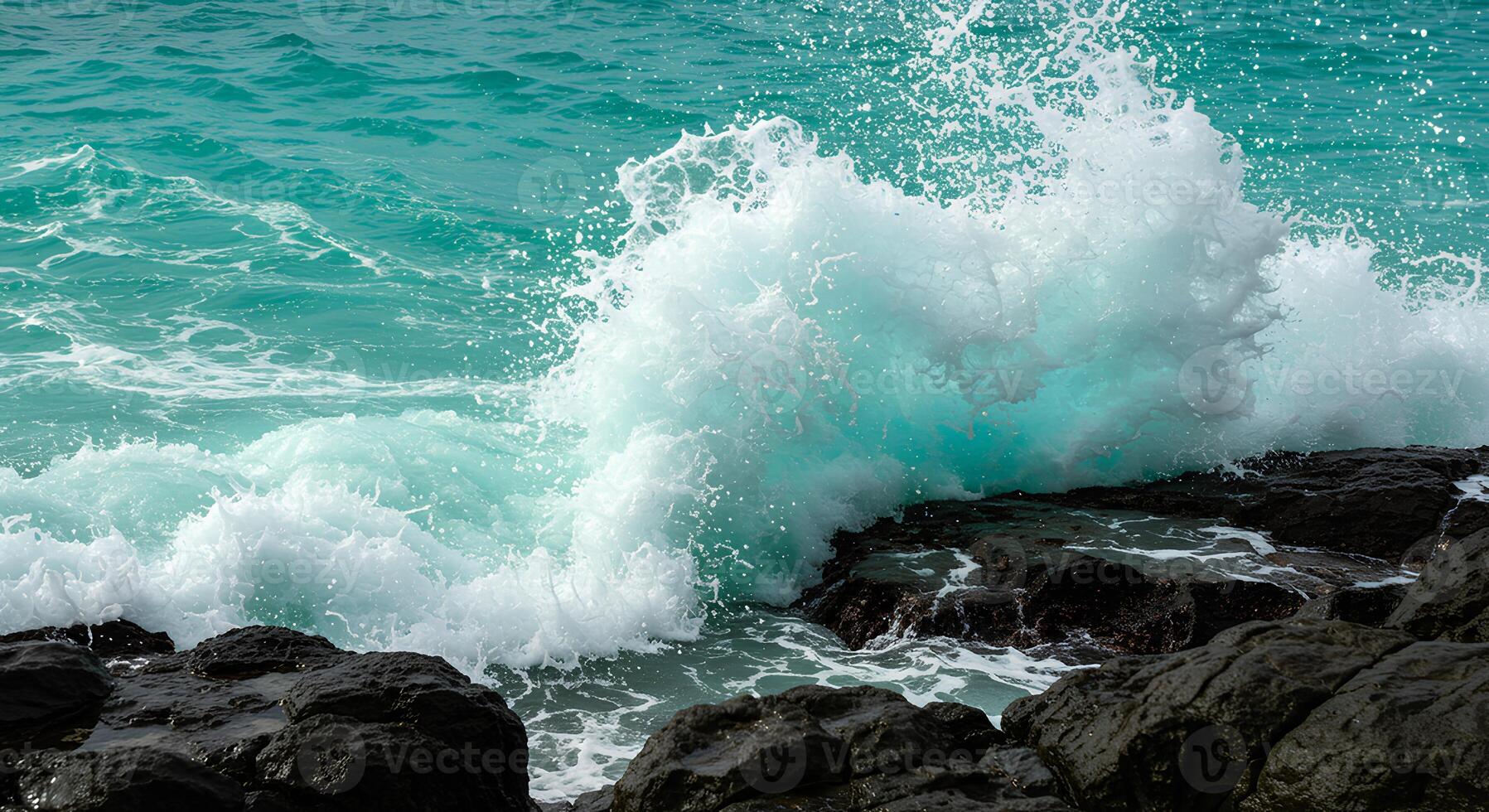 Powerful ocean waves splashing onto rocks during summer for tropical beach and nature themes photo