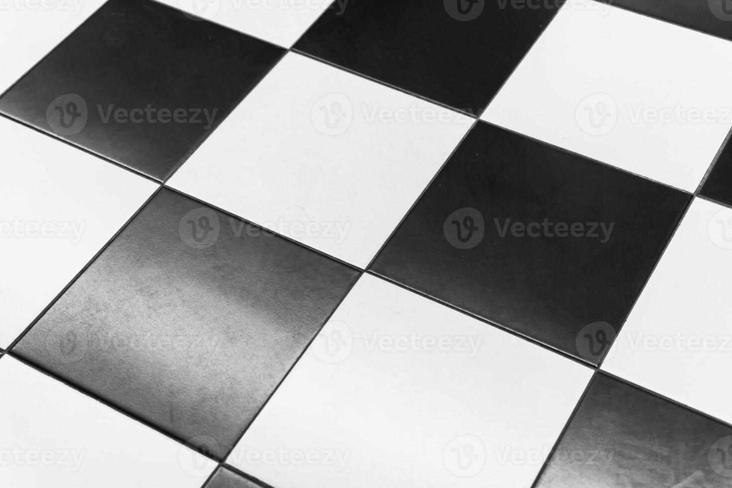 Black and white checkerboard pattern on a polished surface photo