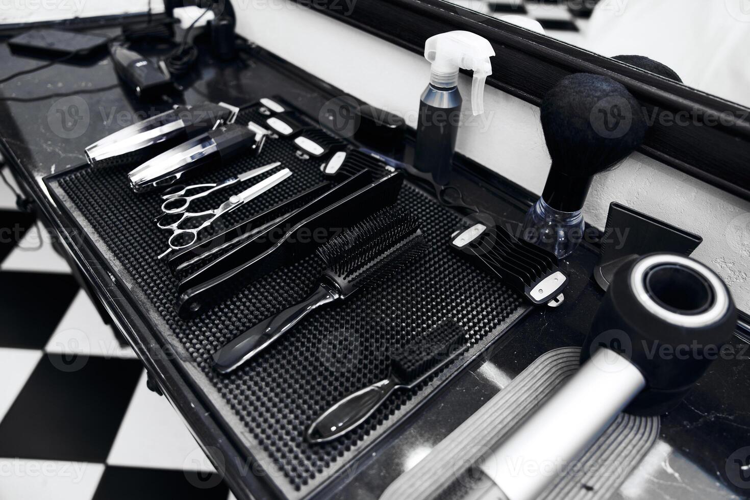 Tools of the trade arranged neatly on a barber shop counter photo