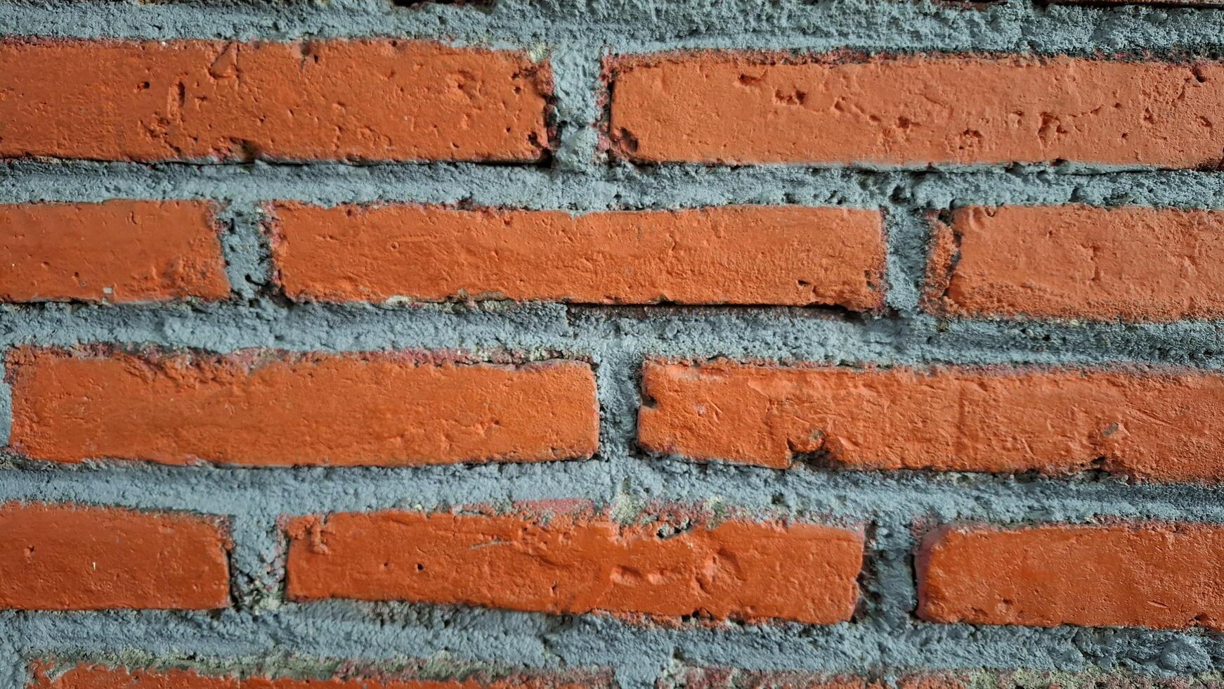 Brick background taken from a landscape angle. Unplastered brick wall. photo
